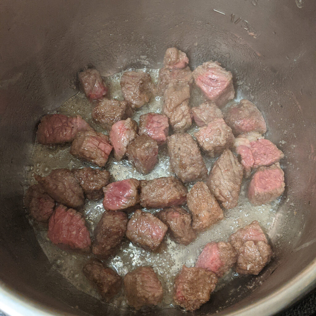 Browning your stew meat in your Instapot is an important step in making a great stew. 