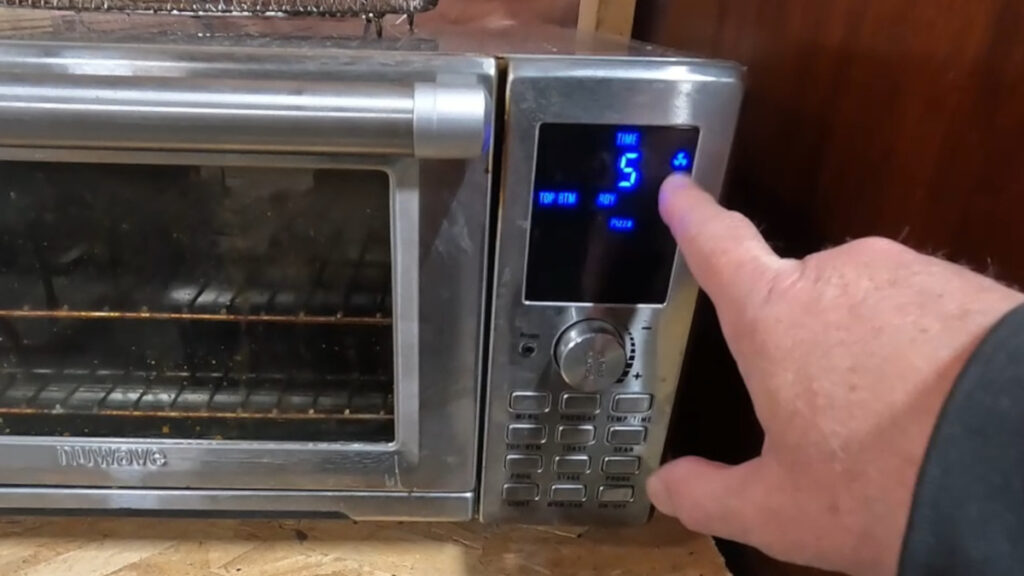 Toaster oven control panel with convection fan setting highlighted